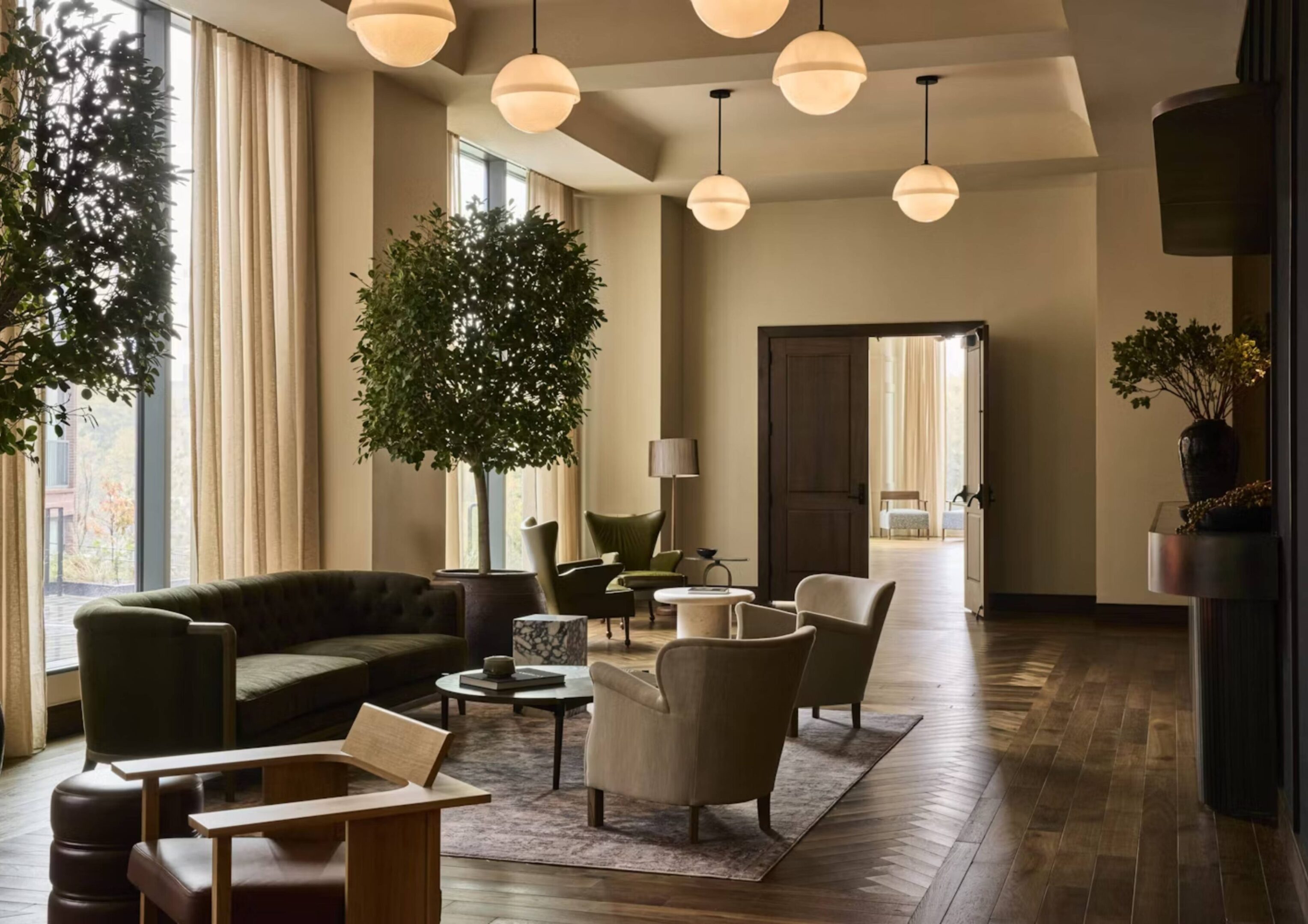 Modern lounge with cozy seating and lighting.